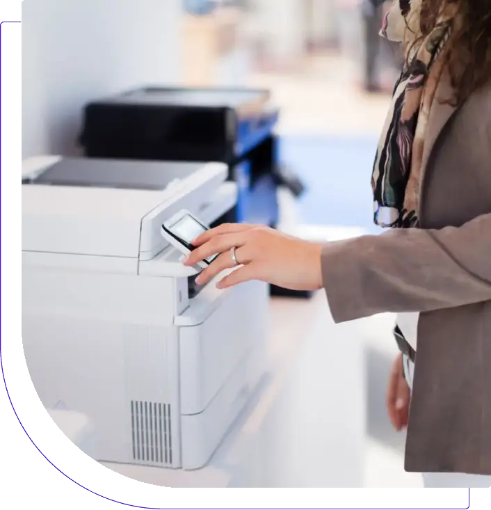 A person using a printer to copy documents.
